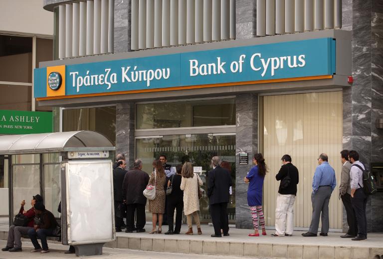 Bank of Cyprus 2014 loss narrows sharply