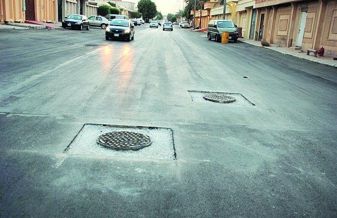 Saudi- Manhole covers not protected by asphalt a hazard to road users Saudi- Manhole covers not protected by asphalt a hazard to road users