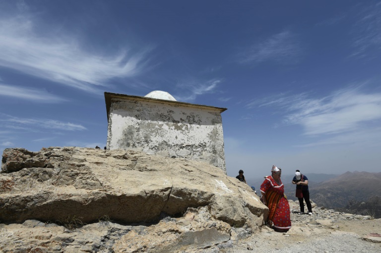 Pilgrims cast prayers to the skies from Algeria mountain peak