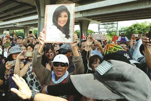Former Thai PM misses verdict, faces arrest