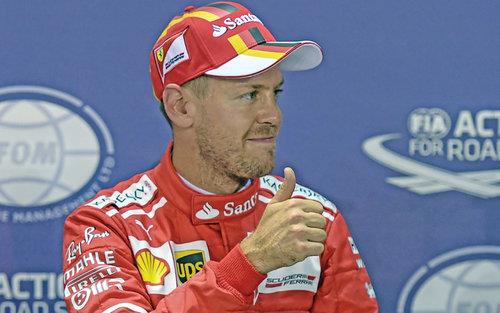Oman- Formula One: Stunning Vettel grabs Singapore pole