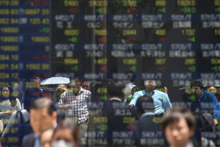 Asian markets mostly climb as Catalan relief supports euro