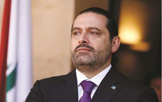 Lebanon PM Hariri quits, says his life is in danger