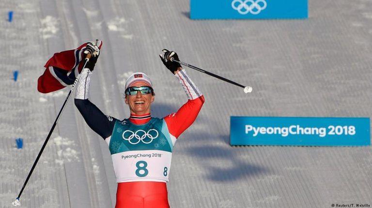 Winter Olympics: Marit Bjoergen puts Norway top of the medals table