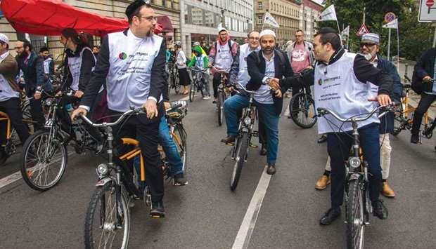Imams, rabbis ride in Berlin rally