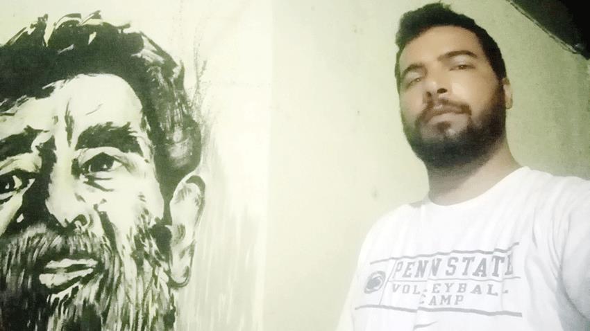 الـتـحـقـيـق مـع نـاشـــط تونسي رسم صورة صدام حسين على جدار 