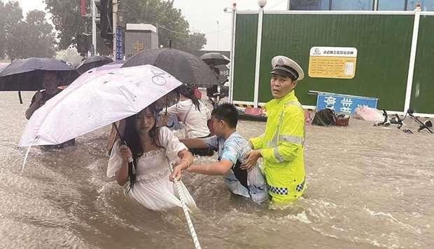 Torrential rains kill 25 in central China