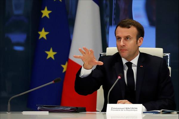 Macron hopes strutting on world stage will be noticed at home