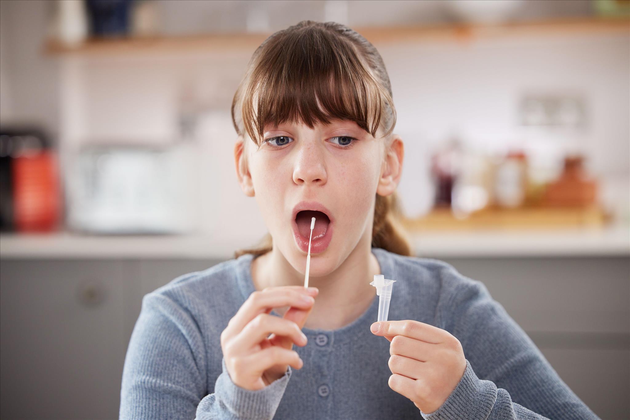 Omicron: viral load can be at its highest at day five so cutting isolation period doesn't make sense Daisy-Daisy / Alamy Stock Photo