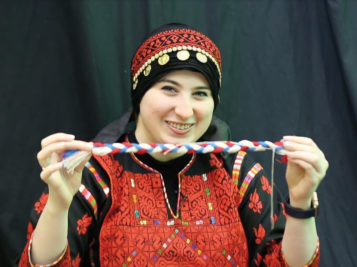 QF Graduate Transforms Embroidery Into Melodies About Her Homeland