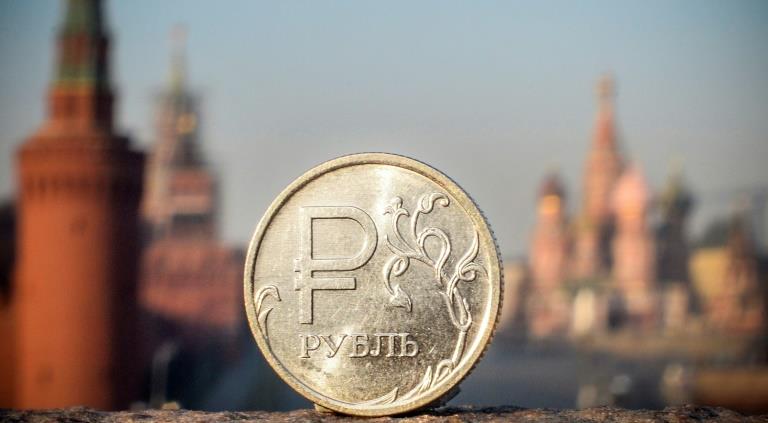 Russian central bank slashes rate to rein in ruble
