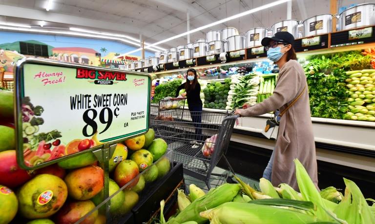 US price surge eased in April as shoppers continued to spend