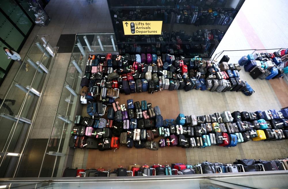 Luggage Piles In Airports Add To Summer Travel Chaos
