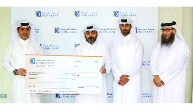 Qatar Charity Receives Donation From Doha Bank For Disaster Victims