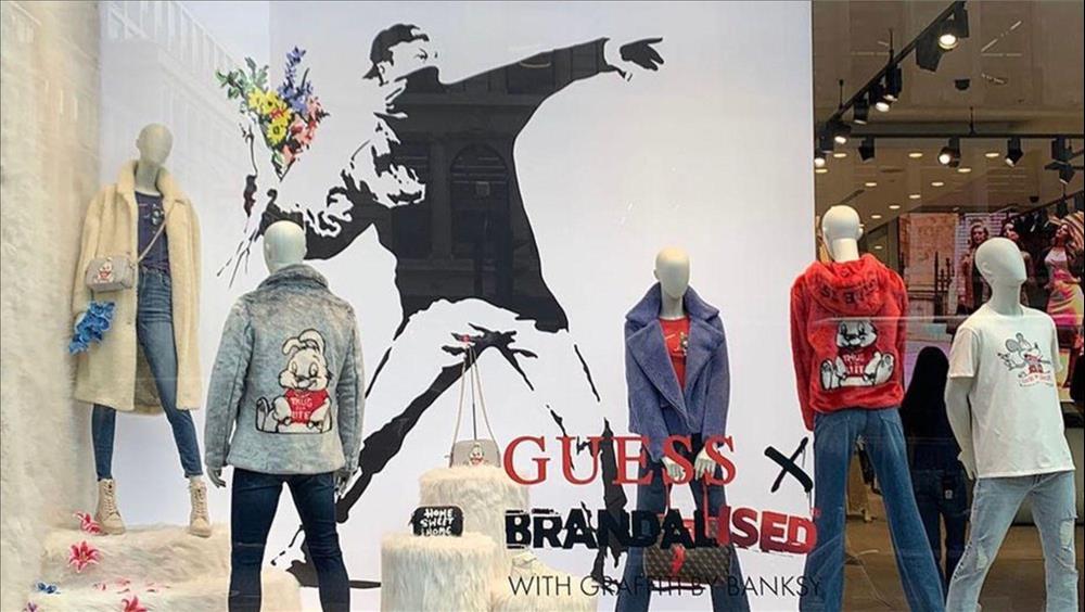 Banksy Calls Out Fashion Brand Guess For Using Flower Thrower Image In London Store Display
