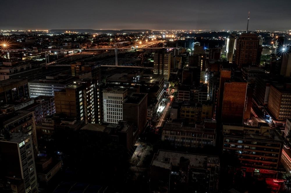 As Lights Go Off, Homeless Offer Respite To Johannesburg Motorists