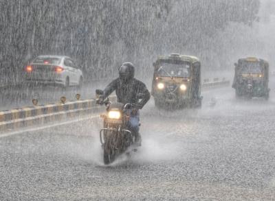  Portion Of Road Caves In As Heavy Rain Lashes Delhi 