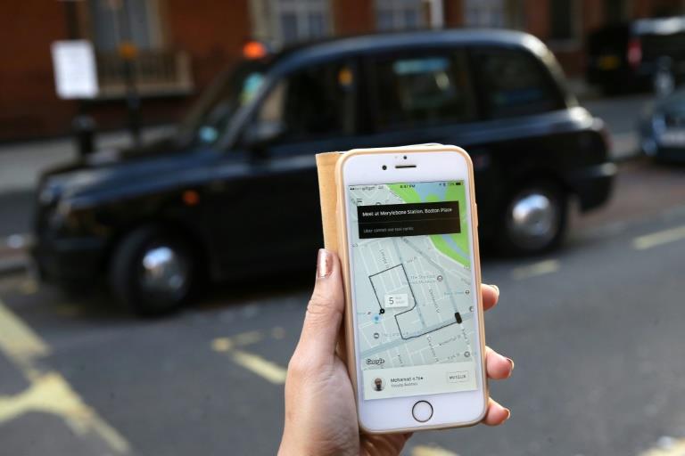 Uber to partner with London's black cabs despite disputes