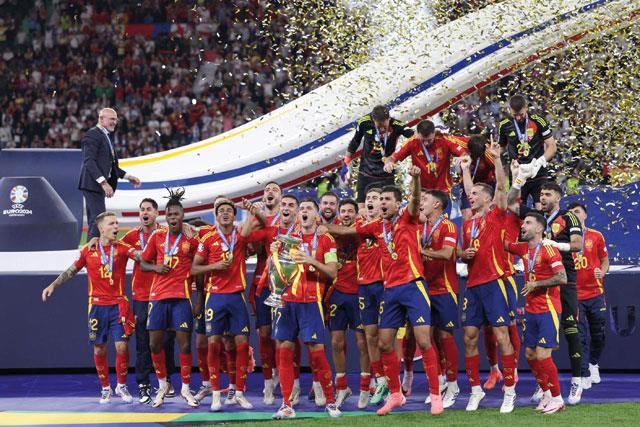 Spain Wing Wizards Williams And Yamal Inspire Euro 2024 Triumph Spain's forward #07 Alvaro Morata holds the trophy and celebrates with teammates after winning the UEFA Euro 2024 final football match between Spain and England at the Olympiastadion in Berlin on Sunday (AFP photo)