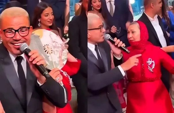 سيدة تقتحم حفل عمرو دياب لتقبّل يده ورد فعله يشعل المنصات التواصل - فيديو سيدة تقتحم حفل عمرو دياب لتقبّل يده ورد فعله يشعل المنصات التواصل - فيديو