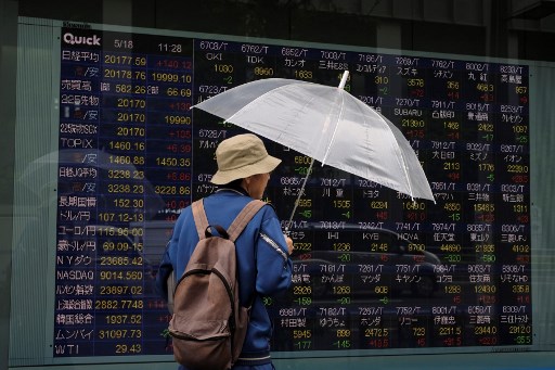 Asian stocks fall following volatile day on Wall Street 